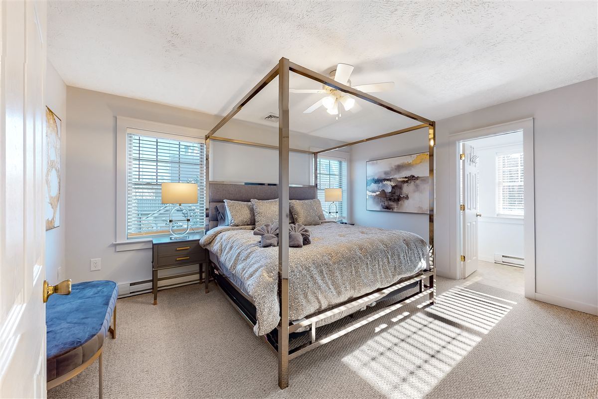Stylish vacation rental bedroom with blue accent wall
